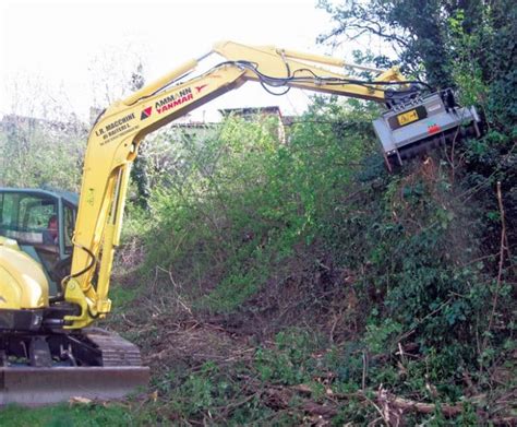 mini excavator on grass|Understanding Brush Cutters and Flail Mowers for Compact .